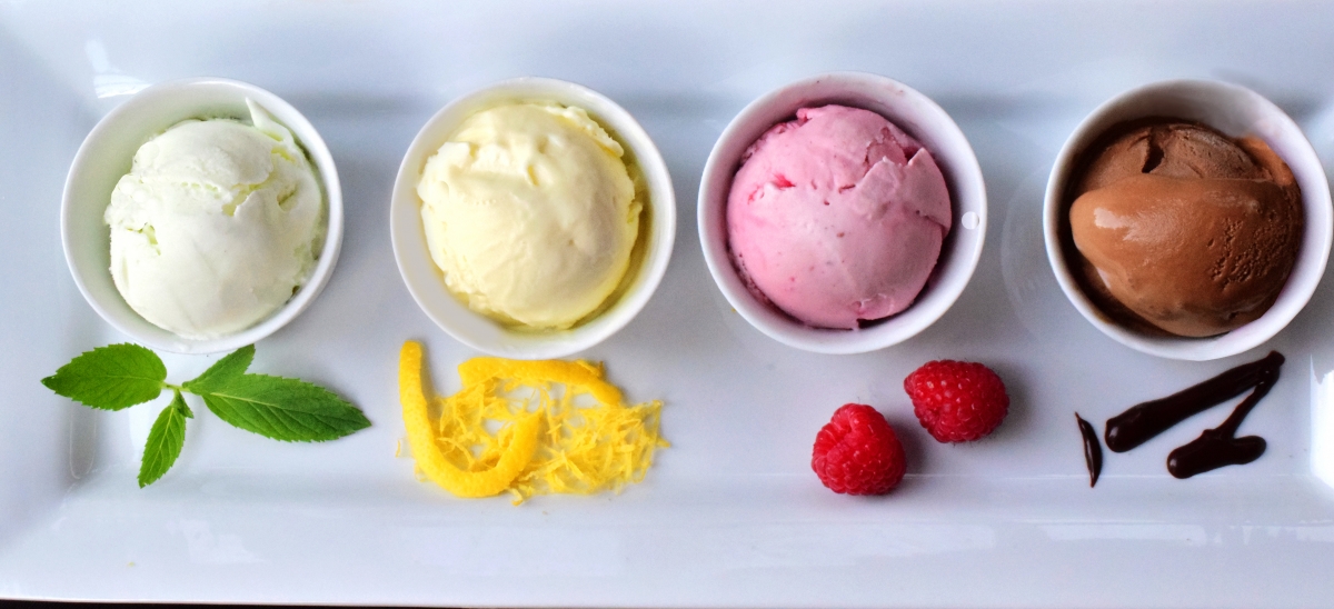 Four scoops of ice cream on a tasting plate