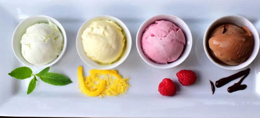 Four scoops of ice cream on a tasting plate